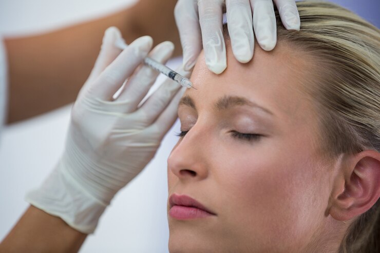 female patient receiving botox injection forehead 107420 74099